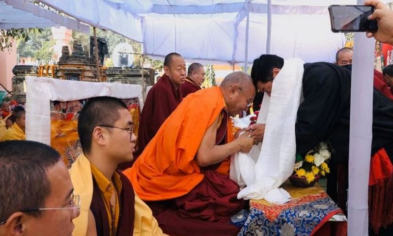 Sikyong greets Khochen Rinpoche at the Monlam festival in Bodh Gaya.