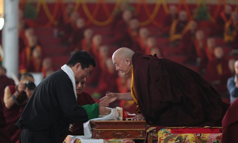 Sikyong greets Kyabje Tsurphu Goshir Gyaltsab Rinpoche at the 37th Kagyu Monlam Festival in Bodh Gaya.