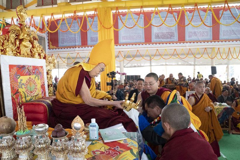 Pema Jungney, Speaker of the Tibetan Parliament in exile making traditional offerings during the Long Life Ceremony for His Holiness the Dalai Lama at the Kalachakra Ground in Bodhgaya, Bihar, India on December 31, 2018. Photo by Lobsang Tsering