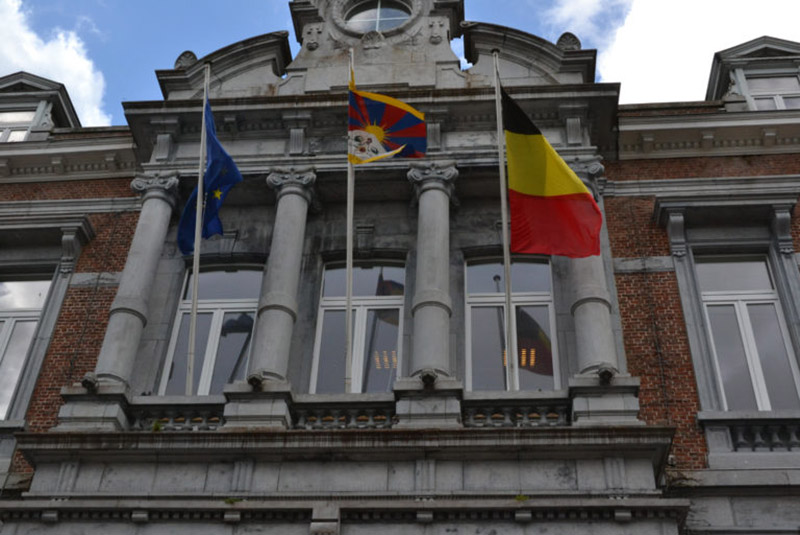 Tibetan flag raised at the town hall in Ciney, Belgium. Photo: Office of Tibet, Brussels