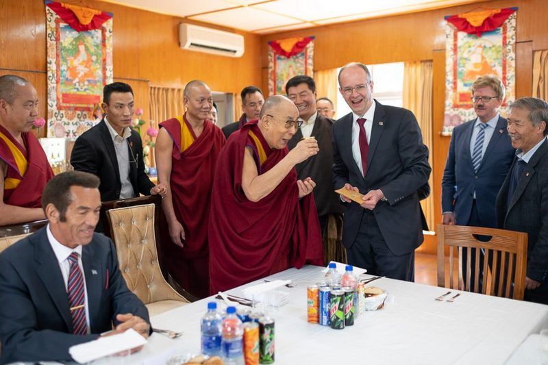 Michael Brand, Member of the German Bundestag presenting a bottle of honey to His Holiness at the start of their luncheon at his residence in Dharamsala, HP, India on March 10, 2019. Photo by Tenzin Choejor