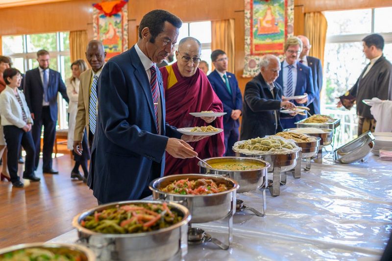 Former President of Botswana Ian Khama and His Holiness helping themselves to the different vegetarian dishes prepared for their luncheon at his residence in Dharamsala, HP, India on March 10, 2019. Photo by Tenzin Choejor